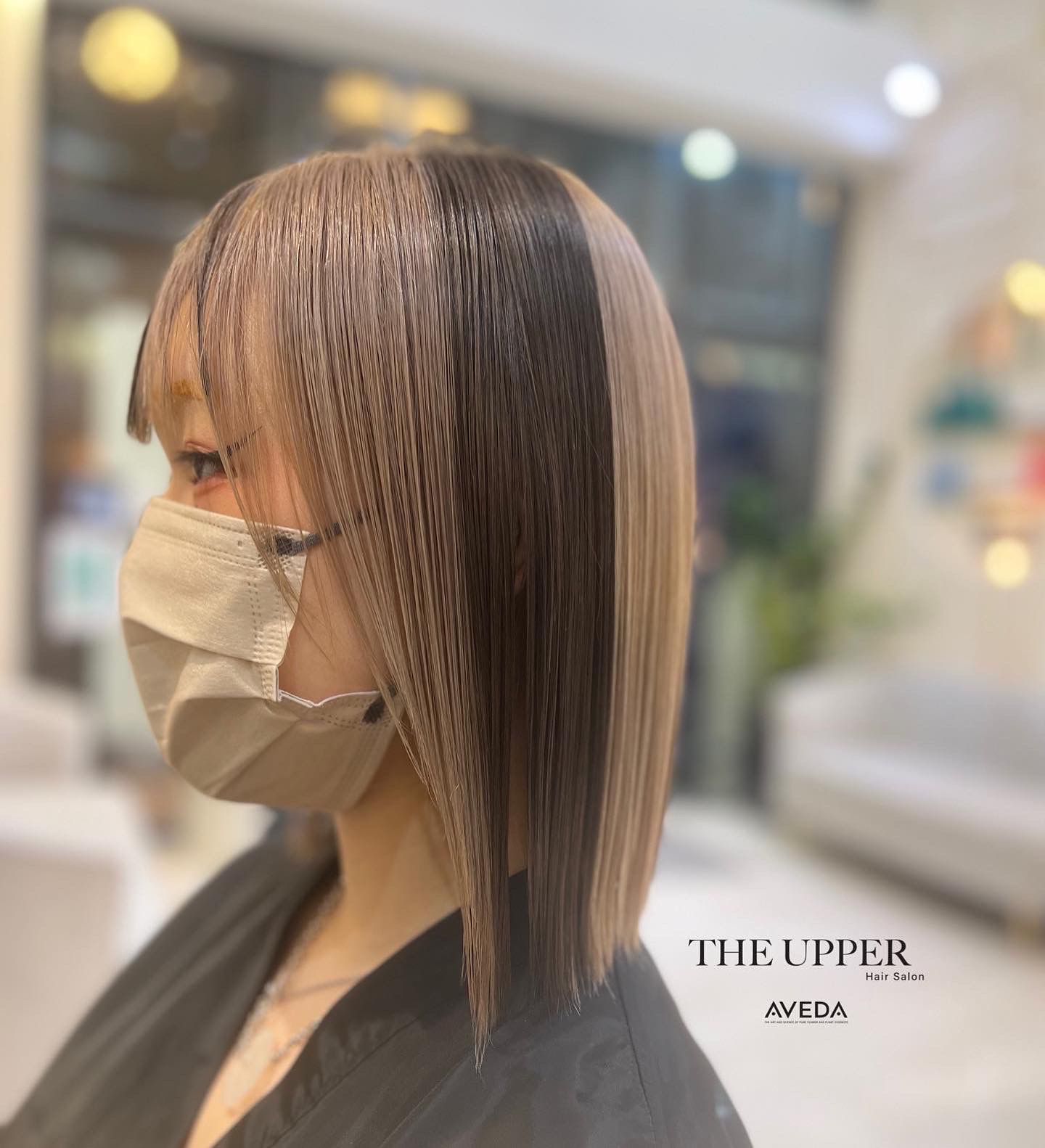Rich brunette layers cascading over one shoulder