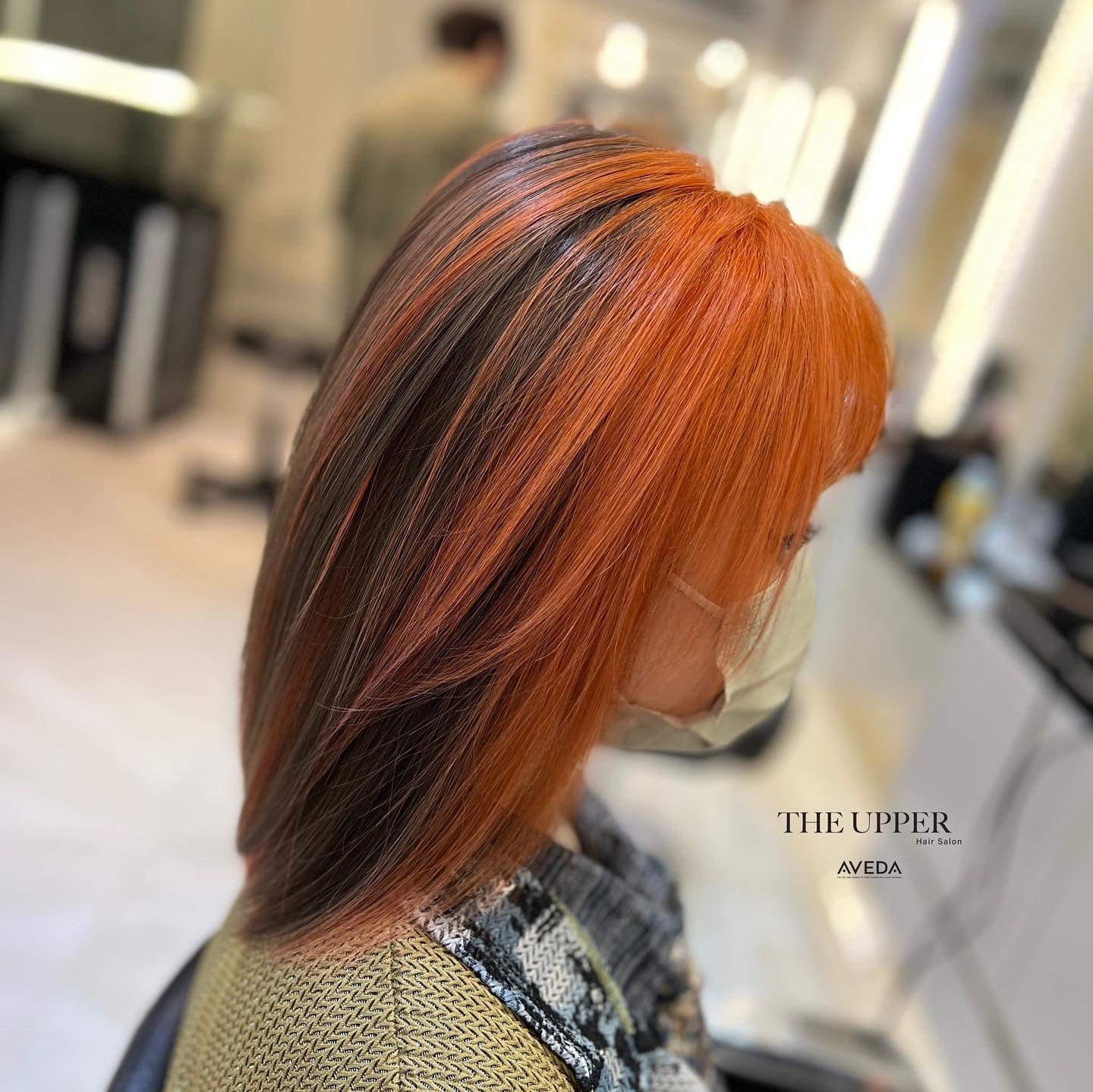 Copper balayage lob styled in tousled beach waves