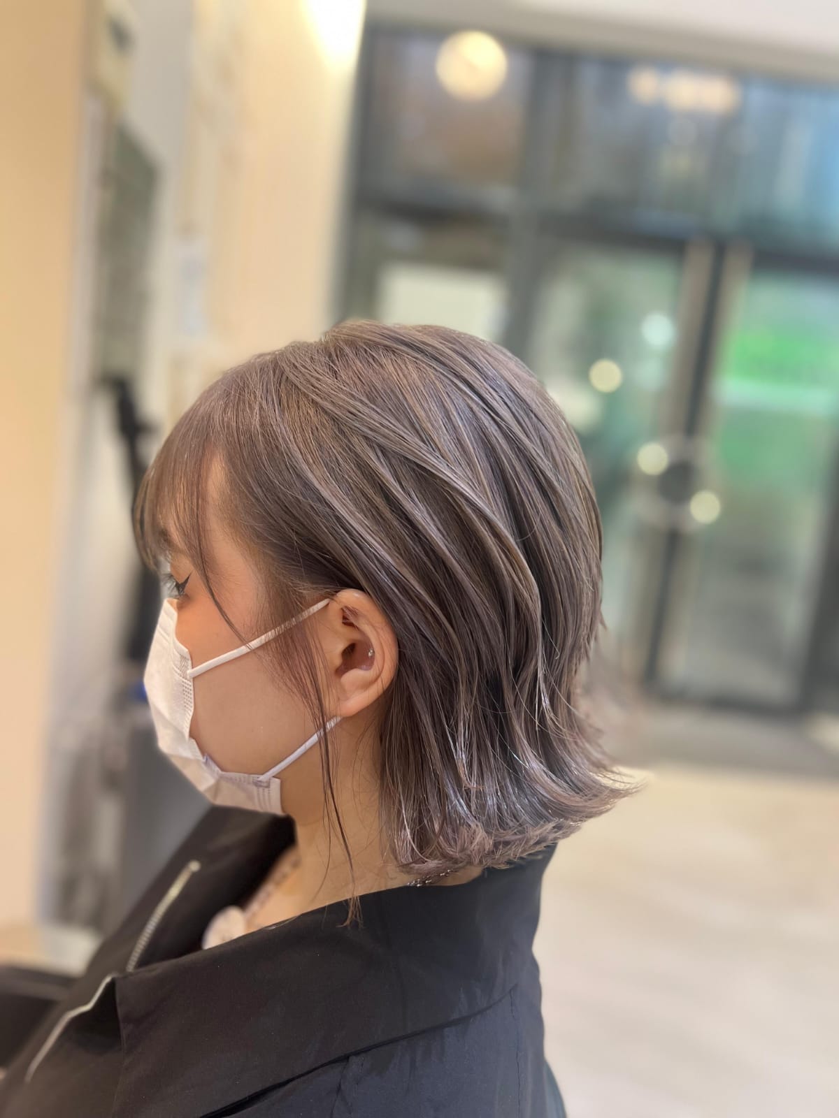 Golden brown long hair swept back with airy layers