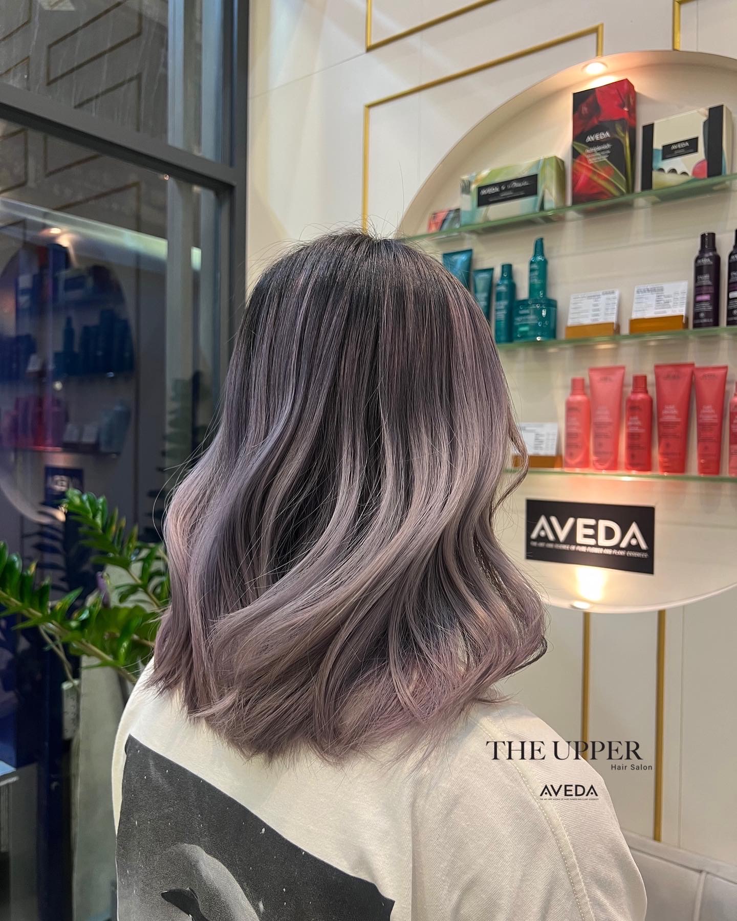 Smoky brunette mid-length waves with subtle highlights